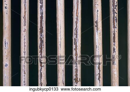 Close-up of a fence of metal rods View Large Photo Image Stock Image - Close-up of a fence of metal rods. Fotosearch