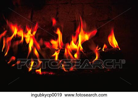 Close-up of a fire lit in a fireplace View Large Photo Image Stock Photo - Close-up of a fire lit in a fireplace. Fotosearch