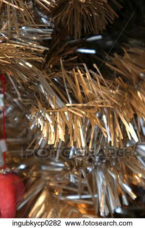 Close-up of a gold and silver artificial Christmas tree View Large Photo Image Stock Image - Close-up of a gold and silver artificial Christmas tree. Fotosearch