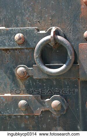 Close-up of a metal door with a round handle View Large Photo Image Picture - Close-up of a metal door with a round handle. Fotosearch