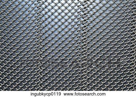 Stock Photo - Close-up of a metal fence. Fotosearch