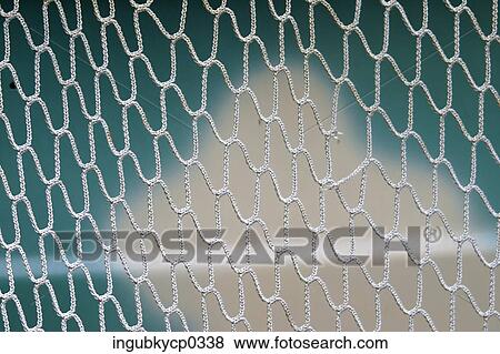 Close-up of a metal fence View Large Photo Image Stock Photo - Close-up of a metal fence. Fotosearch