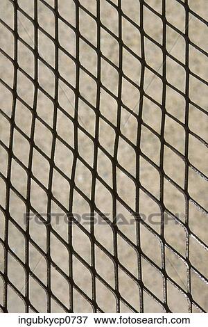 Close-up of a metal grill View Large Photo Image Stock Photo - Close-up of a metal grill. Fotosearch