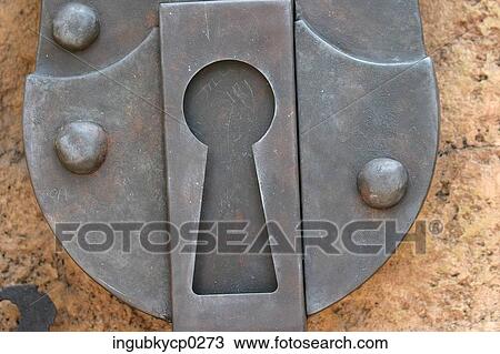 Close-up of a metal keyhole View Large Photo Image Stock Image - Close-up of a metal keyhole. Fotosearch