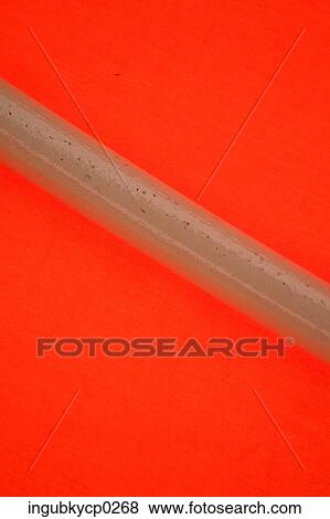 Stock Photo - Close-up of a pole against a red background. Fotosearch