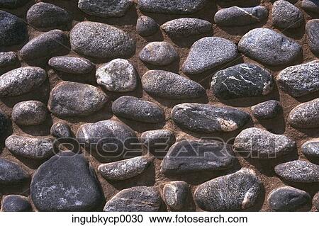 Close-up of a rocks embedded in a wall View Large Photo Image Stock Image - Close-up of a rocks embedded in a wall. Fotosearch