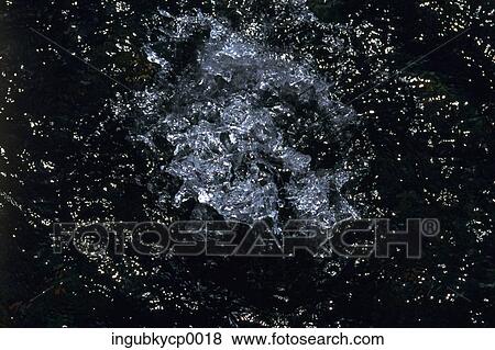 Close-up of a splash in water View Large Photo Image Stock Photo - Close-up of a splash in water. Fotosearch