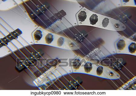 Close-up of an abstract shot of guitars View Large Photo Image Stock Image - Close-up of an abstract shot of guitars. Fotosearch