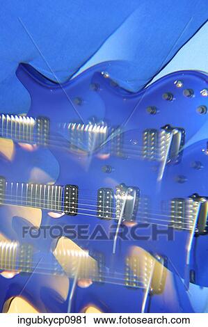 Close-up of an abstract shot of guitars View Large Photo Image Stock Image - Close-up of an abstract shot of guitars. Fotosearch