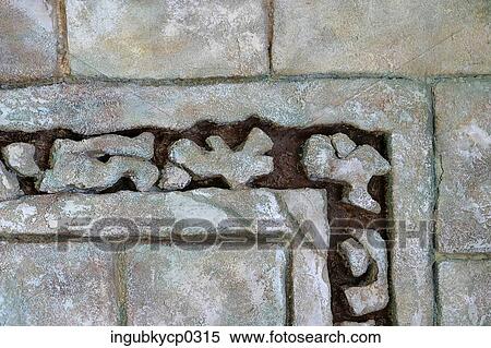 Close-up of carved shapes on a stone wall View Large Photo Image Stock Photography - Close-up of carved shapes on a stone wall. Fotosearch