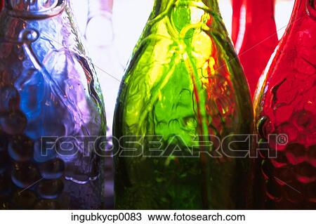 Close-up of glass bottles View Large Photo Image Stock Image - Close-up of glass bottles. Fotosearch