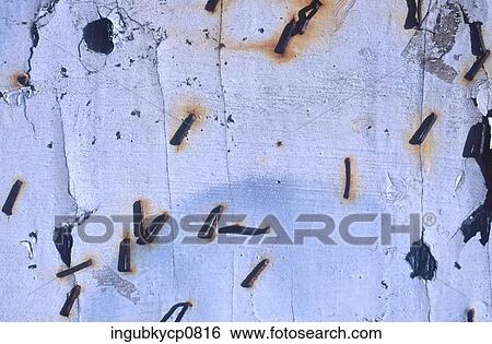 Close-up of metal pieces embedded in a wall View Large Photo Image Stock Photograph - Close-up of metal pieces embedded in a wall. Fotosearch
