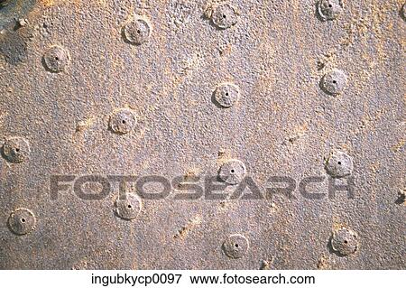 Close-up of rivets on a metal surface View Large Photo Image Stock Photo - Close-up of rivets on a metal surface. Fotosearch
