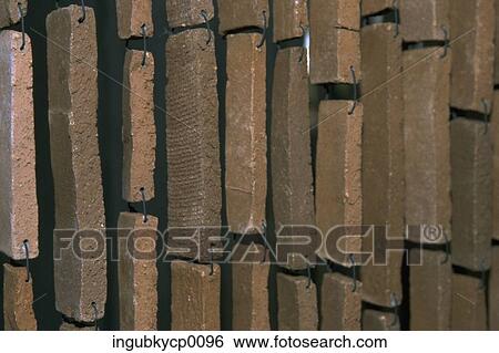 Close-up of stone bricks hanging with wire View Large Photo Image Stock Photograph - Close-up of stone bricks hanging with wire. Fotosearch