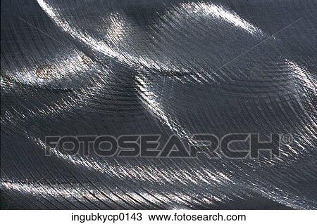Close-up of the surface of a shiny fabric View Large Photo Image Stock Image - Close-up of the surface of a shiny fabric. Fotosearch