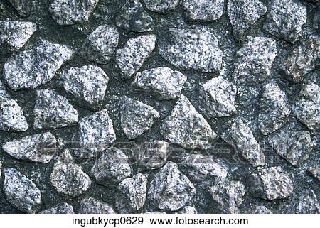 Stock Photo - Close-up of the surface of a stone wall. Fotosearch