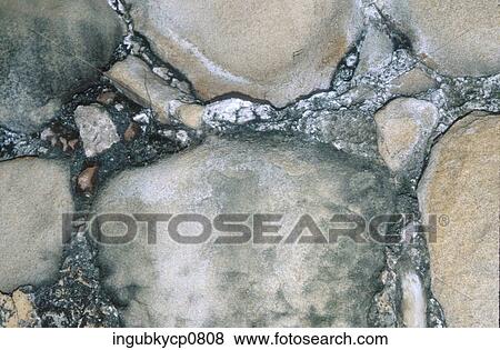 Close-up of the surface of a stone wall View Large Photo Image Stock Photo - Close-up of the surface of a stone wall. Fotosearch