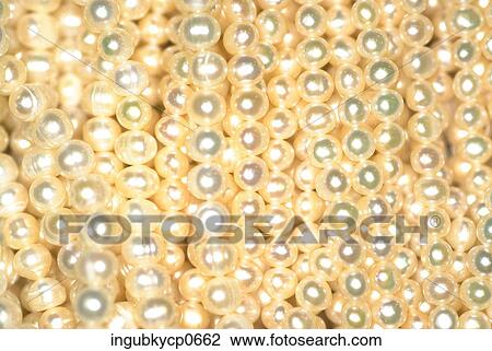 Stock Image - Close-up of the surface of beads. Fotosearch