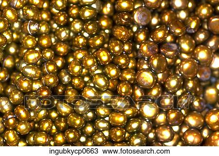 Stock Image - Close-up of the surface of beads. Fotosearch