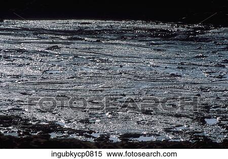 Stock Photography - Close-up of water collected on a rocky surface. Fotosearch