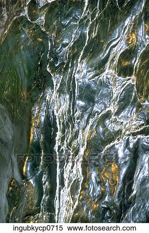 Close-up of water flowing down a rock surface View Large Photo Image Stock Photography - Close-up of water flowing down a rock surface. Fotosearch