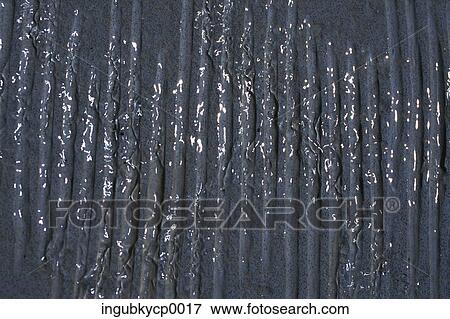 Stock Photo - Close-up of water flowing down a wall. Fotosearch