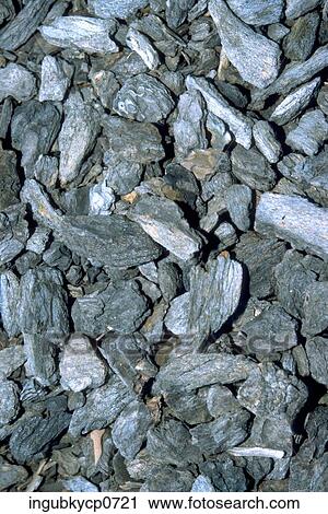 Stock Image - High angle view of a pile of grey rocks. Fotosearch