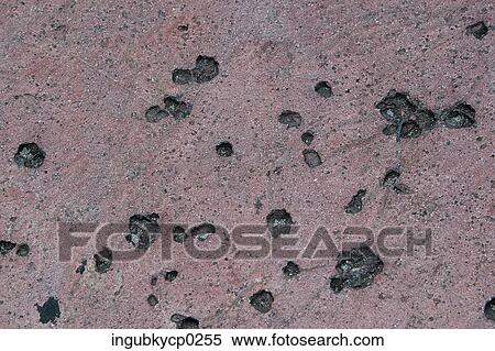 High angle view of stones embedded in sand View Large Photo Image Stock Photography - High angle view of stones embedded in sand. Fotosearch