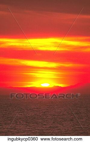 Stock Image - Panoramic view of the sea at dusk. Fotosearch