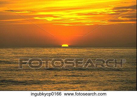 Stock Photograph - Panoramic view of the sea at dusk. Fotosearch