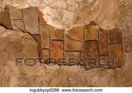Patch of brick work exposed on a wall View Large Photo Image Stock Photograph - Patch of brick work exposed on a wall. Fotosearch