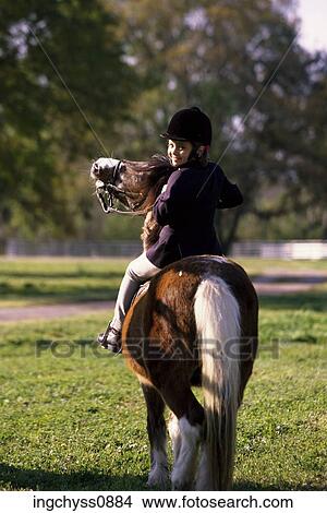 Picture - Field, grass, clothing, portrait, leisure, ride, casual. Fotosearch