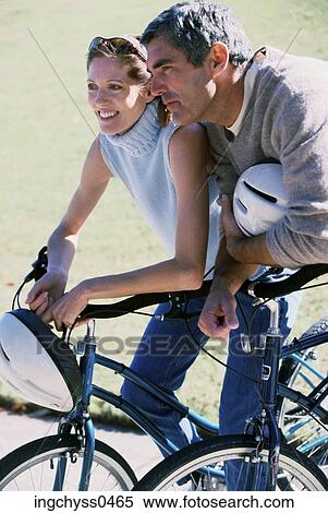 grass, men, smile, cycling, clothing, jeans, turtleneck View Large Photo Image Stock Photography - grass, men, smile, cycling, clothing, jeans, turtleneck. Fotosearch
