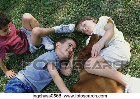 grass, people, resting, smile, child, children, short View Large Photo Image Stock Photo - grass, people, resting, smile, child, children, short. Fotosearch