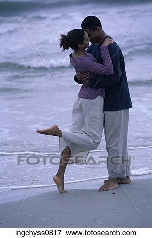Stock Photo - group, men, embracing, stand, romance, love, embrace. Fotosearch
