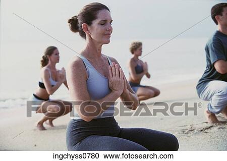 Stock Image - group, men, ponytail, prayer, class, full, exercising. Fotosearch