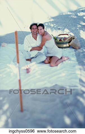 Stock Photograph - group, men, vacations, down, resting, smile, barefoot. Fotosearch