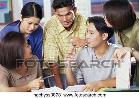 Stock Image - group, people, boys, girls, looking down, clothing, casual. Fotosearch
