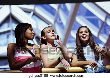 Stock Photography - group, people, stand, away, girls, shop. Fotosearch