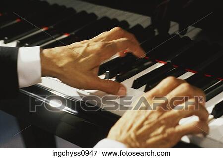 Stock Photo - key, hand, One Person, Human Hand, Part Of, piano key, leisure activity. Fotosearch