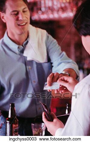 male, bar, restaurant, tavern, paying, credit card, serving View Large Photo Image Stock Image - male, bar, restaurant, tavern, paying, credit card, serving. Fotosearch
