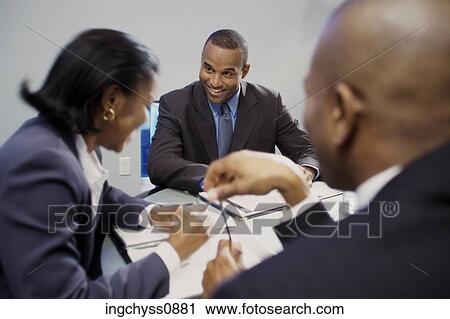 Stock Image - meeting, men, down, writing, teamwork, smile, background. Fotosearch