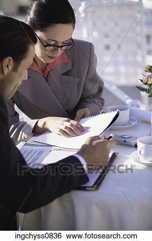 Stock Photograph - meeting, men, looking, teamwork, restaurant, showing, food. Fotosearch
