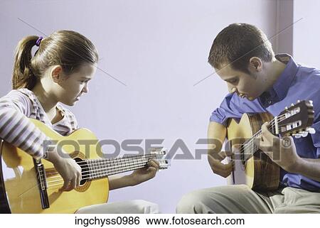 men, people, learning, girls, looking down, clothing, casual View Large Photo Image Stock Photograph - men, people, learning, girls, looking down, clothing, casual. Fotosearch