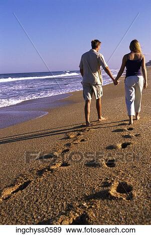 men, sand, barefoot, holding hands, full, footprint View Large Photo Image Stock Photo - men, sand, barefoot, holding hands, full, footprint. Fotosearch