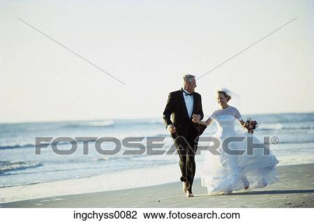 men, sand, bouquet, holding hands, love, tuxedo, full View Large Photo Image Stock Image - men, sand, bouquet, holding hands, love, tuxedo, full. Fotosearch