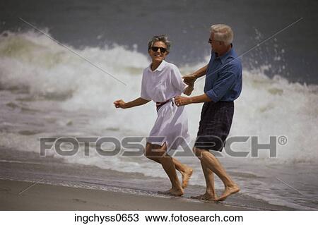 men, sand, smile, short, barefoot, holding hands, full View Large Photo Image Stock Image - men, sand, smile, short, barefoot, holding hands, full. Fotosearch