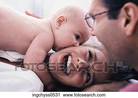 men, women, bonding, infant, lying, togetherness, shoulders View Large Photo Image Stock Image - men, women, bonding, infant, lying, togetherness, shoulders. Fotosearch