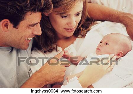 men, women, father, fun, looking down, clothing, happiness View Large Photo Image Picture - men, women, father, fun, looking down, clothing, happiness. Fotosearch