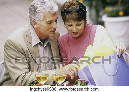men, women, fun, shop, looking down, clothing, shopping bag View Large Photo Image Stock Photo - men, women, fun, shop, looking down, clothing, shopping bag. Fotosearch